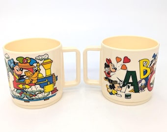 Vintage 1980s Adorable Pair of Disney plastic "Snack and Fun Time" Child's Mugs with characters - V5081
