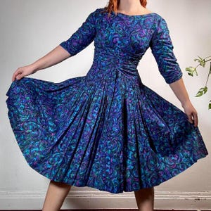 Vintage 80s style dress with colorful pattern and cinched waist