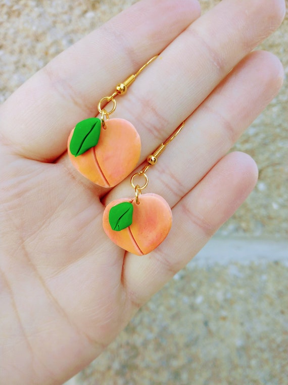 Peach clay earrings deals