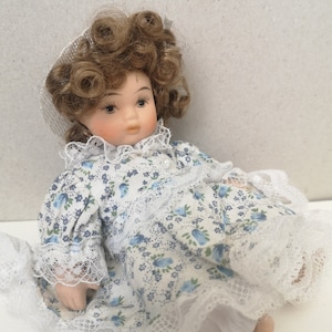 Vintage porcelain doll in a hat, small baby doll 80s, doll with curly hair, cute doll as gift