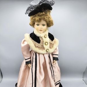 Vintage Victorian doll in winter luxury outfit with fur, porcelain doll collection with black hat, beautiful collectible doll as a gift