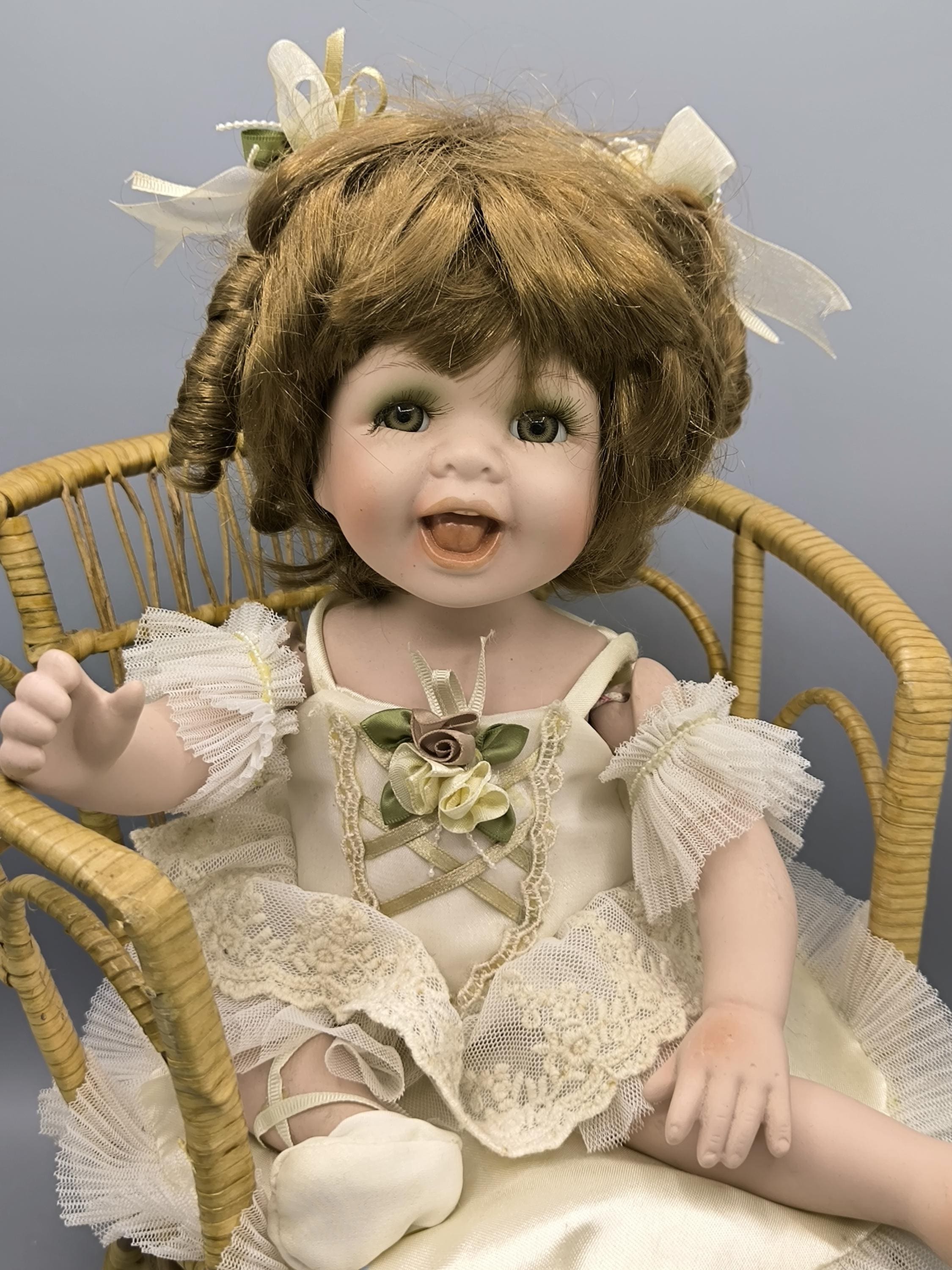 Vintage Porcelain Doll in a Wicker Chair, Laughing Doll Girl With