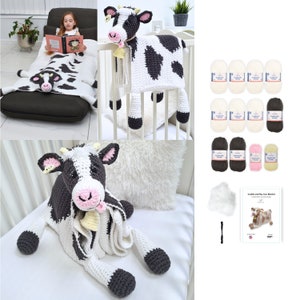 May include: A collection of handmade crochet items, including a cow-shaped blanket, a cow-shaped pillow, and a large cow plushie. The blanket and pillow feature black and white patterns. Also included are yarn skeins in various colors and a pattern booklet.
