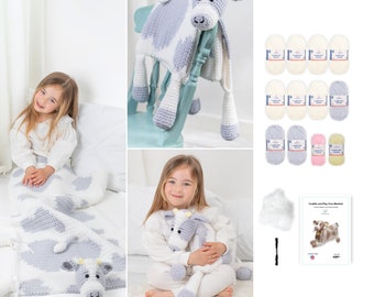 May include: A crochet cow blanket and plush toy set. The blanket is white with gray cow spots and the toy is gray and white with a white face. The set includes yarn, stuffing, a crochet hook, and instructions.