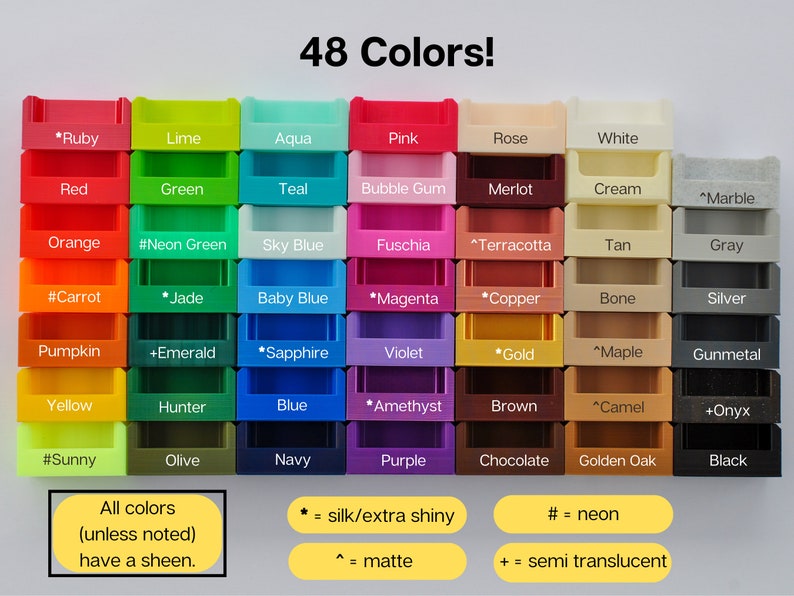 May include: A chart of 48 different colors of plastic containers. The colors are arranged in rows and columns. Each container has a label with the color name. Some colors have additional markings indicating if they are extra shiny, matte, or semi-translucent.