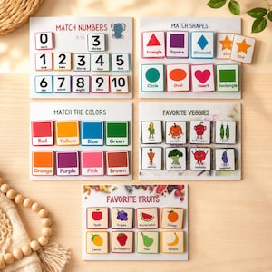 May include: Educational matching game sets for children. Includes boards for matching numbers, shapes, colors, favorite veggies, and fruits. Each set features colorful illustrations and labels, perfect for early learning and cognitive development.