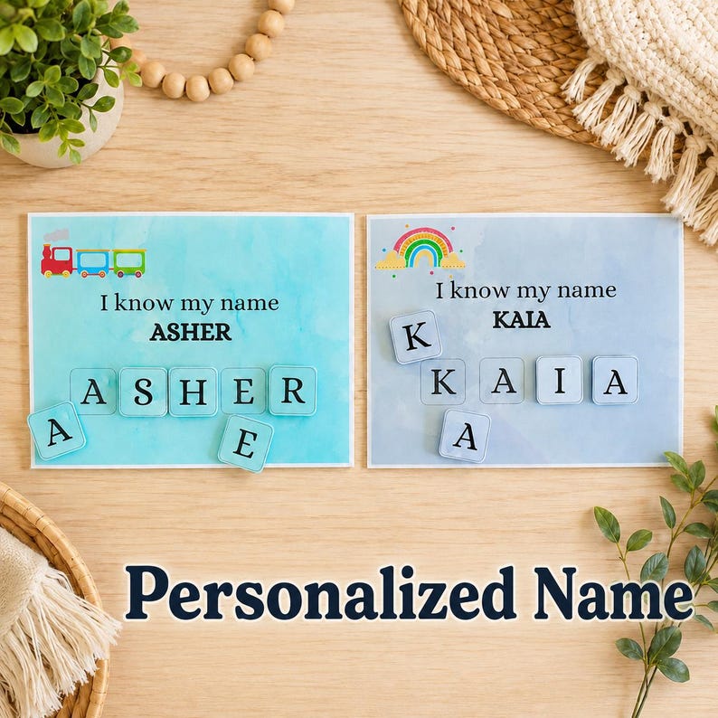 May include: Two personalized name learning cards. One card features a train graphic and the name "ASHER" with letter tiles. The other card has a rainbow graphic and the name "KAIA" with letter tiles. The text "I know my name" is above each name. The words "Personalized Name" are at the bottom.