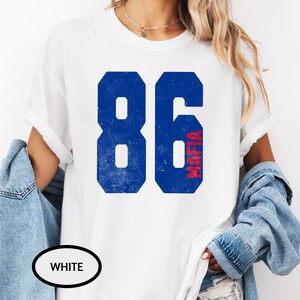 May include: White t-shirt with a blue and red graphic of the number 86 with the word "Mafia" vertically written inside the 6.