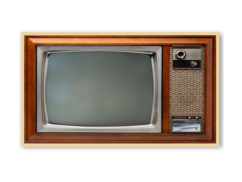 May include: A vintage wooden framed television with a black and white screen and a silver control panel. The television has a brown wood grain finish and a silver metal trim.