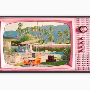 May include: A pink retro television set with a black frame showing a scene of a mid-century modern home with a swimming pool and palm trees.