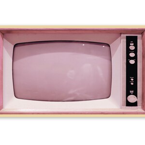 May include: A vintage television set with a pink screen and a wooden frame. The television has a black control panel with knobs and a dial.