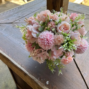 Prosecco and artificial flowers centre pieces