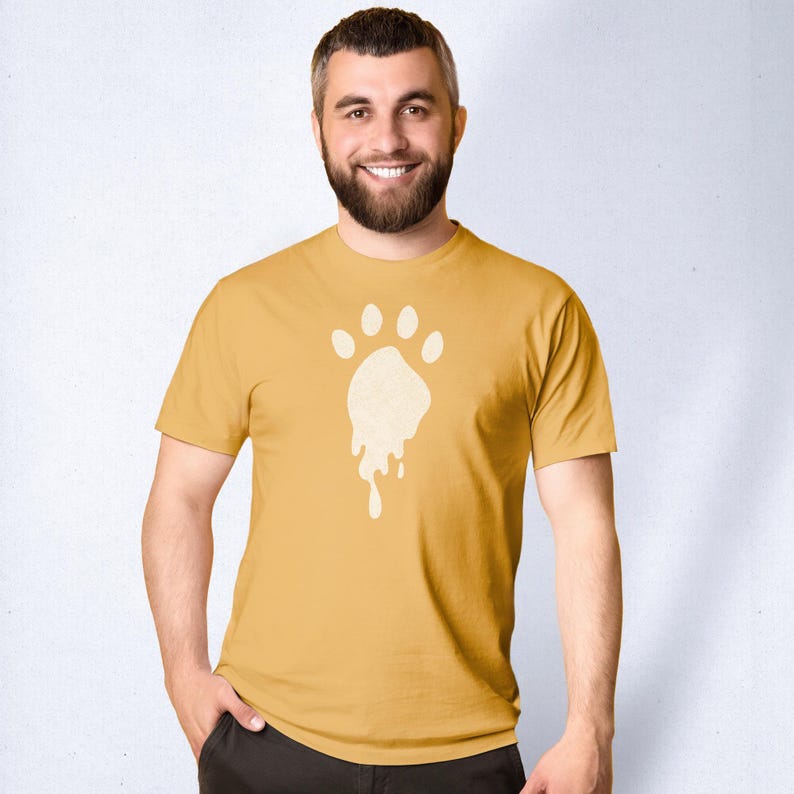 Bear Trail | Raunchy Tees for Gay Bears, Cubs, Queer Otters | Scruffy, Bearded Muscle Daddy Cum Dumps & DILFs Hunting for Cock | Model wears mustard tee with with a dripping paw print