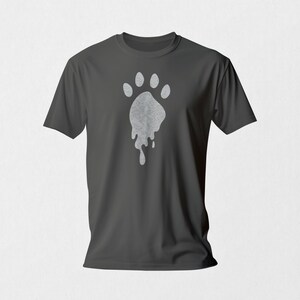 May include: A dark gray t-shirt with a white, dripping paw print design.