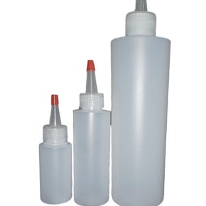 May include: Three clear plastic squeeze bottles with red caps and white lids. The bottles are different sizes.
