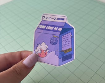 May include: A purple and blue sticker in the shape of a milk carton, featuring a cartoon character and Japanese text. The sticker has the words "Gomu Gomu No Mi" and a cartoon character with a swirl of white hair.
