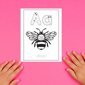 May include: A black and white illustration of a bee with the letter 'A' and the word 'abeja' written below. The letter 'A' is dotted to help with tracing.