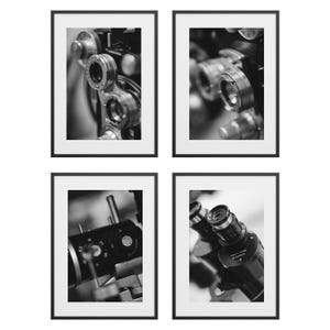 May include: Set of four framed black and white photographs. Each features a close-up of vintage ophthalmic equipment. The images showcase the intricate details of the lenses, dials, and mechanisms of the instruments.