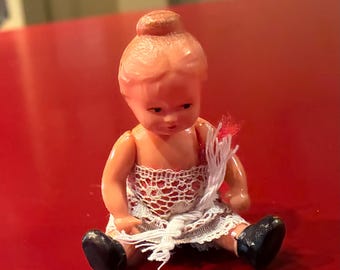 Antique German Celluloid “Edi” Puppen Pocket Doll Wrapped in Lace, 3 inches tall