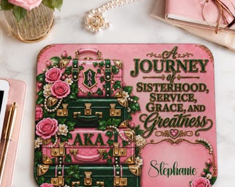 May include: A rectangular mousepad featuring a stack of four vintage-style suitcases in alternating shades of pink and dark green, adorned with pink roses, pearls, and the text A JOURNEY OF SISTERHOOD, SERVICE, GRACE, AND GREATNESS with the name Stephanie.