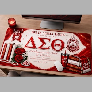 May include: A rectangular desk mat featuring Delta Sigma Theta Sorority, Inc. branding in red and white. It displays the Greek letters, the crest, an elephant emblem, red roses, a string of pearls, and a stack of books labeled with core values.