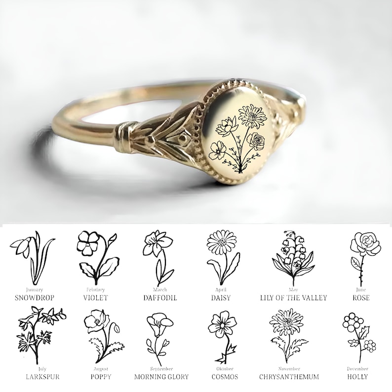 May include: A gold signet ring with a floral design. The ring features a variety of flowers, including a daisy, a rose, and a lily of the valley. The ring is engraved with the names of the flowers and the months they bloom in.