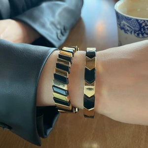 Black and gold plated detailed bangle cuff bracelet