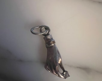 Vintage sterling silver hand holding silver charm