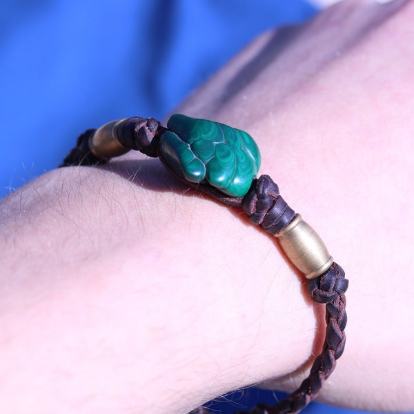 Leather bracelet with green symbol stone