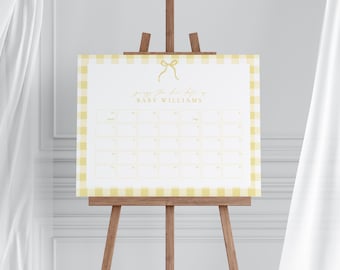 May include: A baby shower game sign on a wooden easel. The sign has a yellow and white gingham border and features the text "guess the due date of BABY WILLIAMS" in gold script. The sign has a grid of boxes for guests to write their guesses.