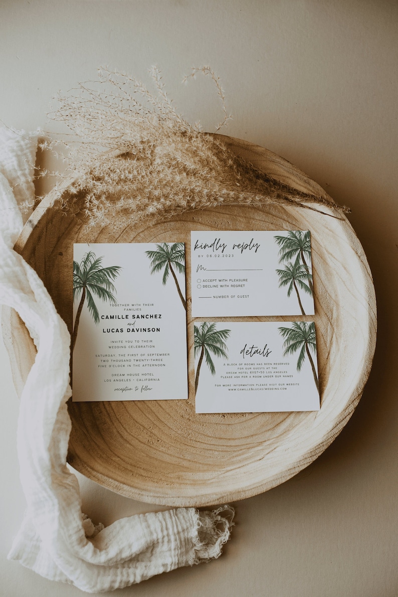 May include: Wedding invitation suite with a tropical theme. The invitation features palm trees and the text "Together with their families, Camille Sanchez and Lucas Davison invite you to their wedding celebration, Saturday, the first of September, two thousand twenty-three, five o'clock in the afternoon, Dream House Hotel, Los Angeles, California, reception to follow". The RSVP card has the text "Kindly reply by 08.02.2023, Accept with pleasure, Decline with regret, Number of guest". The details card has the text "Details, A block of rooms has been reserved for our guests at the Dream Hotel, XYZ, Los Angeles, California, Please ask for a room under our names, For more information please visit our website, www.camilleslucaswedding.com".