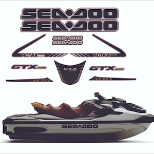 May include: A black and white Sea-Doo GTX Limited watercraft with a brown seat and the text "Sea-Doo" and "GTX Limited" on the side.