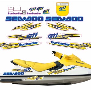 May include: A white and yellow Sea-Doo GTI jet ski with blue and yellow graphics. The jet ski has the words "Sea-Doo" and "GTI" on the side. The jet ski is on a white background.