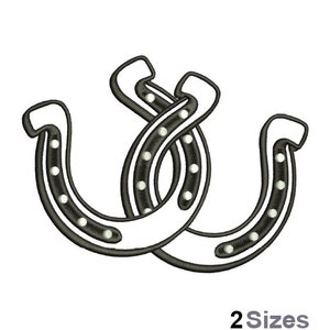 May include: Two black and white horseshoes with white dots, intertwined, on a white background. The text "2 Sizes" is below the horseshoes.