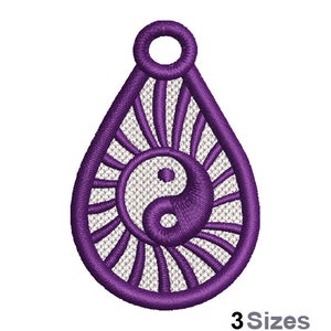 May include: Purple teardrop-shaped pendant with a yin yang symbol inside and a sunburst design around it.