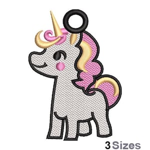 May include: Embroidered patch of a white unicorn with a pink mane and tail, gold horn, and black eyes. The unicorn has a black ring attached to the top of its head.