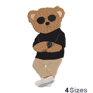 May include: Embroidered image of a brown teddy bear wearing black sunglasses, a black top, beige trousers, and white trainers. The bear has its arms crossed and is wearing a watch. The text "4 Sizes" is in the bottom right corner.