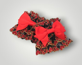Puños de muñeca con corazón rojo y encaje negro