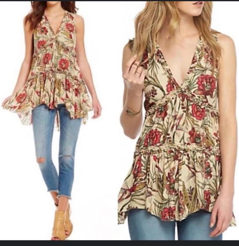 May include: A sleeveless top with a V-neck and a floral pattern in red, cream, and green. The top has a ruffled hem and is paired with blue jeans. The overall style is bohemian.