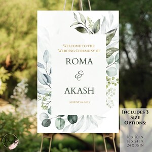 May include: Wedding ceremony sign with a watercolor design of eucalyptus leaves in shades of green and blue. The sign reads "Welcome to the Wedding Ceremony of Roma & Akash August 19, 2023". It also includes three size options: 16 x 20 in, 18 x 24 in, and 24 x 36 in.