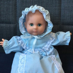 Vintage 9 inch Cititoy or Similar Bald Baby Doll in Blue Gown and Bonnet with Open Close Eyes