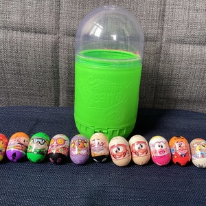 Coleção vintage ou aposentada Moose Mighty Beanz de onze feijões com recipiente de armazenamento verde