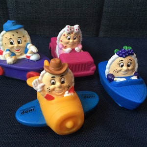 Vintage Collection of Four Different IHOP House of Pancakes PVC Figures on Wheels