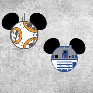 May include: Two Star Wars characters, BB-8 and R2-D2, are depicted as Mickey Mouse with black ears. BB-8 is white with orange accents and R2-D2 is blue and gray.