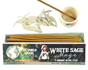 May include: White sage incense set with a ceramic incense holder, dried sage leaves, and a box of 12 handmade incense sticks. The box features the text "WHITE SAGE Mage" and "THE WORLD MAKES Scents".