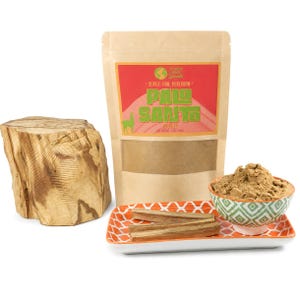 May include: A tan pouch labeled Super-Fine Peruvian Palo Santo Powder with a red graphic, a large piece of light brown wood, two small sticks of wood, and a small bowl of powder on an orange and white patterned rectangular tray.