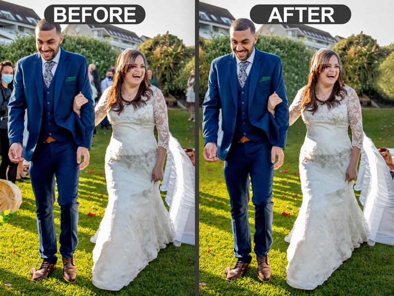 May include: A wedding photo shows a smiling couple walking on a green lawn. The person on the left wears a navy blue suit with a patterned tie. The person on the right wears a white lace wedding dress. The background includes greenery and other wedding guests.