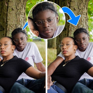 May include: Two people are seated outdoors, leaning against a tree. One wears a black top and the other a white t-shirt. Both wear glasses and have dark hair. A circular inset shows a close-up of one person's face.