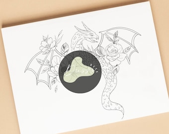 May include: A black and white line drawing of a dragon with floral accents, including roses and other flowers, on a white background. The dragon has wings and a long tail. The artwork is on a white rectangular surface.