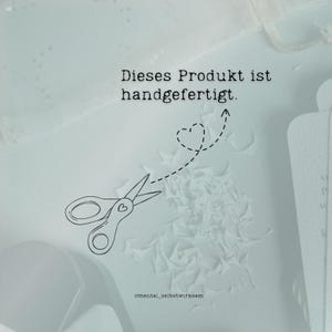 May include: A light blue image with the text "Dieses Produkt ist handgefertigt." A pair of scissors with a heart design is cutting paper, with a dotted line and heart shape above. The image also includes the text "@mental_selbstwirksam."